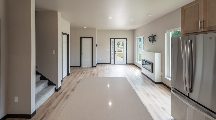 Bison Run Rentals - Low Res-4 Interior of townhome looking at the dining room/living room from the kitchen island.
