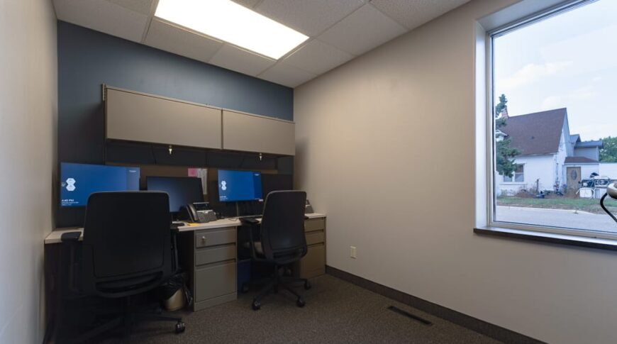 Sanford Hankinson-Low Res-30 Data room at new Sanford Hankinson Clinic with backwall of upper and lower cabinets with two desktop workstations